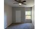 Bedroom with a ceiling fan, carpet, and natural lighting at 8250 N Grand Canyon Dr # 2029, Las Vegas, NV 89166