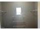 Bright closet with shelving and a window for natural light at 8250 N Grand Canyon Dr # 2029, Las Vegas, NV 89166