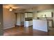 Open-concept kitchen with white cabinetry and modern appliances blends seamlessly with the living space at 8250 N Grand Canyon Dr # 2029, Las Vegas, NV 89166