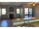 Modern kitchen with island seating area connected to a fireplace-equipped living room at 8250 N Grand Canyon Dr # 2029, Las Vegas, NV 89166