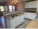 Well-equipped kitchen with a breakfast bar and views of the living room at 8250 N Grand Canyon Dr # 2029, Las Vegas, NV 89166