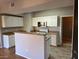 Kitchen features white cabinets and tiled flooring at 8250 N Grand Canyon Dr # 2029, Las Vegas, NV 89166