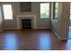 Living room with fireplace, and access to balcony and window at 8250 N Grand Canyon Dr # 2029, Las Vegas, NV 89166