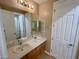 Bathroom boasts a double vanity, ample counter space, and updated fixtures at 8777 Beckett Ridge Ave, Las Vegas, NV 89149