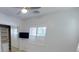 Bright bedroom features natural light, closet, and a wall-mounted television at 8777 Beckett Ridge Ave, Las Vegas, NV 89149