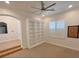 Bright bonus room with carpeted floors, a ceiling fan and built in bookshelves at 8777 Beckett Ridge Ave, Las Vegas, NV 89149