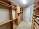 Spacious walk-in closet featuring custom shelving, drawers, and ample hanging space at 8777 Beckett Ridge Ave, Las Vegas, NV 89149