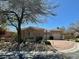 Inviting one-story house featuring a spacious driveway and desert-style landscaping at 8777 Beckett Ridge Ave, Las Vegas, NV 89149