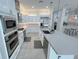 Bright kitchen featuring stainless steel appliances, island, and ample countertop space at 8777 Beckett Ridge Ave, Las Vegas, NV 89149