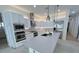 Bright kitchen featuring stainless steel appliances, island, and ample countertop space at 8777 Beckett Ridge Ave, Las Vegas, NV 89149