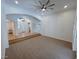 Open-concept living area with vaulted ceilings and a seamless flow into other rooms at 8777 Beckett Ridge Ave, Las Vegas, NV 89149
