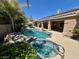 Backyard pool and spa with stone accents at 8777 Beckett Ridge Ave, Las Vegas, NV 89149