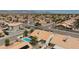 Expansive aerial view of a residential neighborhood featuring homes with pools and desert landscaping at 9091 W Viking Rd, Las Vegas, NV 89147