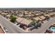 Aerial view of neighborhood featuring backyard pools, desert landscaping, and tile roofs at 9091 W Viking Rd, Las Vegas, NV 89147