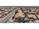 Aerial view of neighborhood featuring backyard pools, desert landscaping, and tile roofs at 9091 W Viking Rd, Las Vegas, NV 89147