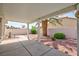 Covered patio and backyard with a palm tree at 9091 W Viking Rd, Las Vegas, NV 89147