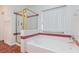 Bright bathroom featuring a soaking tub with shower, with gold toned glass doors at 9091 W Viking Rd, Las Vegas, NV 89147