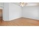 Bright bedroom featuring wood-look flooring, a ceiling fan and white walls at 9091 W Viking Rd, Las Vegas, NV 89147