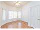 Bedroom with neutral walls, wood floors, and natural light at 9091 W Viking Rd, Las Vegas, NV 89147