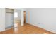Clean bedroom with closet, wood-look flooring and a white door at 9091 W Viking Rd, Las Vegas, NV 89147