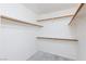 Spacious closet interior showing multiple shelves and metal rods for hanging items at 9091 W Viking Rd, Las Vegas, NV 89147