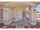 Charming front porch featuring a decorative security door and stylish light fixture at 9091 W Viking Rd, Las Vegas, NV 89147