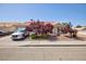 Inviting home exterior with mature trees and well-kept landscaping at 9091 W Viking Rd, Las Vegas, NV 89147