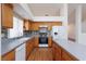 Kitchen with updated appliances, modern backsplash, and ample cabinet space at 9091 W Viking Rd, Las Vegas, NV 89147