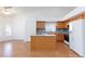 Bright kitchen features a kitchen island, white appliances, and modern countertops at 9091 W Viking Rd, Las Vegas, NV 89147