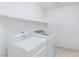 Clean laundry room with modern washer and dryer units at 9091 W Viking Rd, Las Vegas, NV 89147