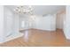 Open living space featuring hardwood floors, neutral paint, and a modern ceiling fan at 9091 W Viking Rd, Las Vegas, NV 89147