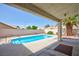 Backyard pool featuring a covered patio and palm tree at 9091 W Viking Rd, Las Vegas, NV 89147