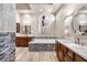 Luxurious bathroom featuring double vanities, a soaking tub, modern tile, and high-end fixtures at 9500 Balatta Canyon Ct, Las Vegas, NV 89144