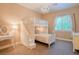 Cozy bedroom featuring a charming chandelier, built-in bunk beds, and a vanity at 9500 Balatta Canyon Ct, Las Vegas, NV 89144