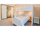 bedroom with bunkbeds, large mirror closet and adjacent vanity at 9500 Balatta Canyon Ct, Las Vegas, NV 89144