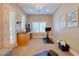 Well-lit exercise room with modern equipment, wall art, and natural light at 9500 Balatta Canyon Ct, Las Vegas, NV 89144