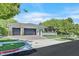 Charming single-story home with lush landscaping and a two-car garage at 9500 Balatta Canyon Ct, Las Vegas, NV 89144