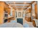 Open concept kitchen with custom cabinets, stainless appliances and adjacent breakfast nook at 9500 Balatta Canyon Ct, Las Vegas, NV 89144