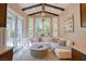 Bright living room features white sectional seating, high ceilings and bay windows at 9500 Balatta Canyon Ct, Las Vegas, NV 89144