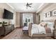 Serene main bedroom featuring a king-size bed, stylish decor, and plenty of natural light at 9500 Balatta Canyon Ct, Las Vegas, NV 89144