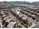 Neighborhood aerial view shows manicured landscaping and tile roofs, close to mountains at 1094 Paradise Resort Dr, Henderson, NV 89002