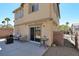 Backyard patio with minimal desert landscaping, outdoor seating, and sliding glass doors to the house at 1094 Paradise Resort Dr, Henderson, NV 89002
