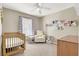 Bright Bedroom features neutral paint, plush carpeting, and a ceiling fan for a comfortable space at 1094 Paradise Resort Dr, Henderson, NV 89002