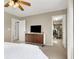 Bedroom with a bed, dresser with TV and walk-in closet, blending comfort and functionality at 1094 Paradise Resort Dr, Henderson, NV 89002