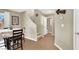 Inviting entryway with staircase, tile flooring, and dining area, creating a warm and welcoming first impression at 1094 Paradise Resort Dr, Henderson, NV 89002