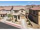 Two-story home features a well-manicured front yard, two-car garage, and a classic design at 1094 Paradise Resort Dr, Henderson, NV 89002