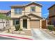 Inviting two-story home featuring a well-maintained front yard and attached one car garage at 1094 Paradise Resort Dr, Henderson, NV 89002
