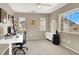 Home office featuring a desk, chair, and natural light from windows, creating a productive workspace at 1094 Paradise Resort Dr, Henderson, NV 89002