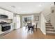 Bright kitchen with stainless steel appliances, white cabinetry, and an adjacent dining area at 1094 Paradise Resort Dr, Henderson, NV 89002