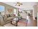 Comfortable living room with a ceiling fan, modern decor, and an open concept design at 1094 Paradise Resort Dr, Henderson, NV 89002